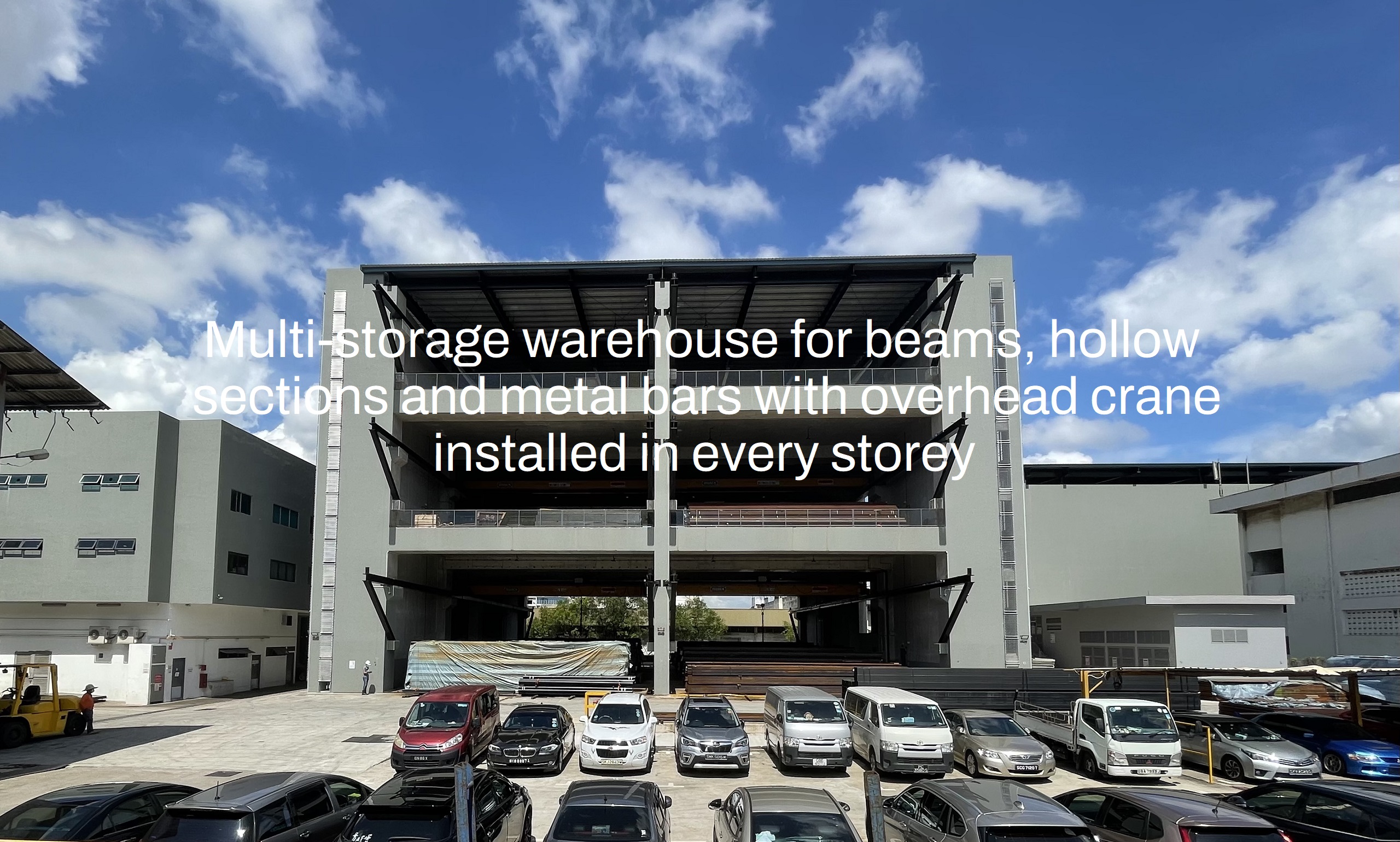 Multi-storage warehouse for beams, hollow sections and metal bars with overhead crane installed in every storey